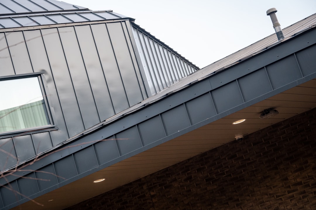 standing seam ridge cap on modern residential metal roof - standing seam ridge cap